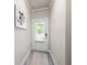 Welcoming entryway featuring a stylish rug and a door with window and blinds at 213 Yellowwood Way, Woodstock, GA 30188