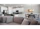 Open living area featuring kitchen, dining, and living room with fireplace, hardwood flooring, and modern decor at 213 Yellowwood Way, Woodstock, GA 30188