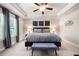 Bedroom with tray ceiling, ceiling fan, and large window at 213 Yellowwood Way, Woodstock, GA 30188