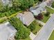 Aerial view of a white two-story home with mature landscaping and a large backyard on a verdant lot at 3405 Haverhill Rowe, Lawrenceville, GA 30044