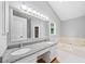 Primary bath with a large tub, double sinks, and granite countertops at 3405 Haverhill Rowe, Lawrenceville, GA 30044