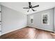 Spacious bedroom features hardwood floors, a ceiling fan, and sun-filled windows at 3405 Haverhill Rowe, Lawrenceville, GA 30044