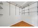 Walk-in closet with wood floor and wire shelving for optimal storage at 3405 Haverhill Rowe, Lawrenceville, GA 30044