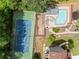 Aerial view of a pool and tennis court available to community members, offering both relaxation and recreation at 3405 Haverhill Rowe, Lawrenceville, GA 30044