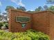 Community sign reads 'Heritage Commons' surrounded by brick and lush greenery and landscaping at 3405 Haverhill Rowe, Lawrenceville, GA 30044