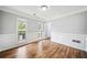 Spacious dining room features hardwood floors, wainscoting, and natural light from large windows at 3405 Haverhill Rowe, Lawrenceville, GA 30044