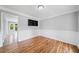 Dining room features hardwood floors, wainscoting, and a view into the kitchen at 3405 Haverhill Rowe, Lawrenceville, GA 30044