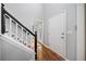 Bright entryway with hardwood floors, staircase with black banister, and a high ceiling at 3405 Haverhill Rowe, Lawrenceville, GA 30044