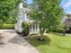 Two-story home featuring a well-manicured lawn and driveway and inviting front porch at 3405 Haverhill Rowe, Lawrenceville, GA 30044