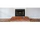 Close-up of fireplace with brick hearth and wood mantel at 3405 Haverhill Rowe, Lawrenceville, GA 30044