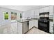 Bright kitchen boasts stainless steel appliances, granite countertops, and access to a patio at 3405 Haverhill Rowe, Lawrenceville, GA 30044