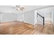 Spacious living room featuring hardwood floors, a staircase, and natural light at 3405 Haverhill Rowe, Lawrenceville, GA 30044