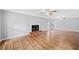 Spacious living room featuring hardwood floors, a fireplace, and natural light at 3405 Haverhill Rowe, Lawrenceville, GA 30044