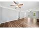 Spacious living room featuring hardwood floors, a fireplace, and natural light at 3405 Haverhill Rowe, Lawrenceville, GA 30044