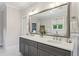 Bathroom featuring a dual sink vanity with a large mirror with brushed metal frame at 3617 Carson Se Ln, Smyrna, GA 30080