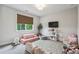 Playroom featuring a comfortable floor sofa, a TV and stuffed toys at 3617 Carson Se Ln, Smyrna, GA 30080