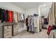 Spacious walk-in closet with ample hanging space and built-in shelving and drawers at 3617 Carson Se Ln, Smyrna, GA 30080