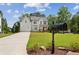 Charming two-story farmhouse with a well-manicured lawn, stylish mailbox and visible basketball hoop at 3617 Carson Se Ln, Smyrna, GA 30080