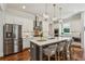 Modern kitchen with a large island, stainless steel appliances, and pendant lighting at 3617 Carson Se Ln, Smyrna, GA 30080