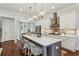 Bright kitchen with a large island, stainless steel appliances, breakfast bar, and a view to the dining area at 3617 Carson Se Ln, Smyrna, GA 30080