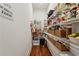 Walk-in pantry with abundant shelving and storage for food and kitchen essentials, complemented by hardwood floors at 3617 Carson Se Ln, Smyrna, GA 30080
