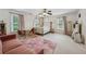 Spacious bedroom with sitting area, ample natural light, and ceiling fan, creating a cozy retreat at 641 Lake Overlook Dr, Canton, GA 30114