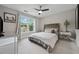 Well-lit bedroom featuring a comfortable bed, ceiling fan, and tasteful decor for a relaxing ambiance at 641 Lake Overlook Dr, Canton, GA 30114