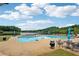 Community pool and seating area with scenic views of the lake at 641 Lake Overlook Dr, Canton, GA 30114