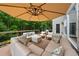 Relaxing deck with outdoor seating, large umbrella, and scenic backyard views at 641 Lake Overlook Dr, Canton, GA 30114