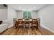 Well-lit dining room featuring a large wooden table, seating for eight, and wood flooring at 641 Lake Overlook Dr, Canton, GA 30114