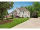 Beautiful two-story home with stone facade, well-maintained lawn, and extended driveway at 641 Lake Overlook Dr, Canton, GA 30114