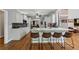 Modern kitchen featuring white cabinetry, granite countertops, stainless steel appliances, and a large island at 641 Lake Overlook Dr, Canton, GA 30114