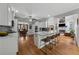 Spacious kitchen with granite counters, a large island with seating, and hardwood flooring throughout at 641 Lake Overlook Dr, Canton, GA 30114