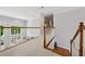 Second floor landing with hardwood staircase and natural light at 641 Lake Overlook Dr, Canton, GA 30114