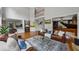Open-concept living area featuring a fireplace, and modern decor with hardwood floors and lots of natural light at 641 Lake Overlook Dr, Canton, GA 30114