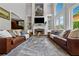Spacious living room with high ceilings, fireplace, built-ins, and ample seating for entertaining at 641 Lake Overlook Dr, Canton, GA 30114