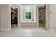 Main bathroom featuring a garden tub, separate glass shower, and walk-in closet at 641 Lake Overlook Dr, Canton, GA 30114