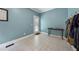 Mud room with blue walls, patterned tile flooring, and coat hooks at 641 Lake Overlook Dr, Canton, GA 30114