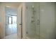 Bathroom boasts a tiled shower with glass doors next to the bedroom's door entrance at 788 W Marietta Nw St # 811, Atlanta, GA 30318