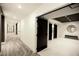 Long condo hallway with doors to other units, elevator and bench at 788 W Marietta Nw St # 811, Atlanta, GA 30318