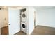 A modern, stacked washer and dryer are in the condo unit at 788 W Marietta Nw St # 811, Atlanta, GA 30318
