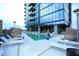 Sparkling pool with lounge chairs and modern lounge furniture at 788 W Marietta Nw St # 811, Atlanta, GA 30318