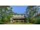 Lush backyard with the home's deck at 1201 Justin Ln, Lithonia, GA 30058