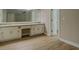 Bathroom featuring a double vanity with plenty of cabinet storage space and modern flooring at 1201 Justin Ln, Lithonia, GA 30058