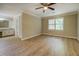 Spacious bedroom with modern flooring, crown molding, a ceiling fan, and ample natural light at 1201 Justin Ln, Lithonia, GA 30058