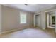 This bedroom offers a window for natural light and closet space at 1201 Justin Ln, Lithonia, GA 30058