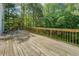 Large wooden deck overlooking a lush green backyard at 1201 Justin Ln, Lithonia, GA 30058