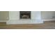 Living room fireplace with painted brick at 1201 Justin Ln, Lithonia, GA 30058