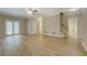 Large living room featuring new wood floors and access to the outside deck at 1201 Justin Ln, Lithonia, GA 30058