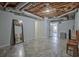 Unfinished basement with exposed ceiling and concrete floors offers potential for customization at 150 Gill Ln, Stockbridge, GA 30281